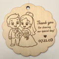 Laser-engraved basswood wedding favor tag with cartoon bride and groom and text Thank you for sharing our special day